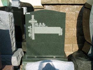 Gray granite monument with cross