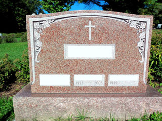 Triple Granite Rose monument with flower border at upper corners and single cross