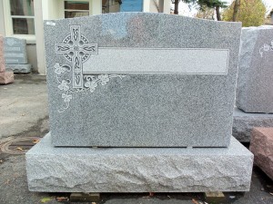 Gray granite memorial with cross
